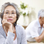 unhappy senior asian couple