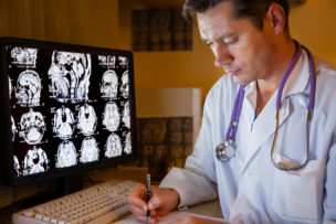 Medical doctor in front of a computer