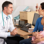 American doctor talking to worried mother