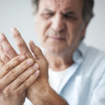 Old man with finger pain