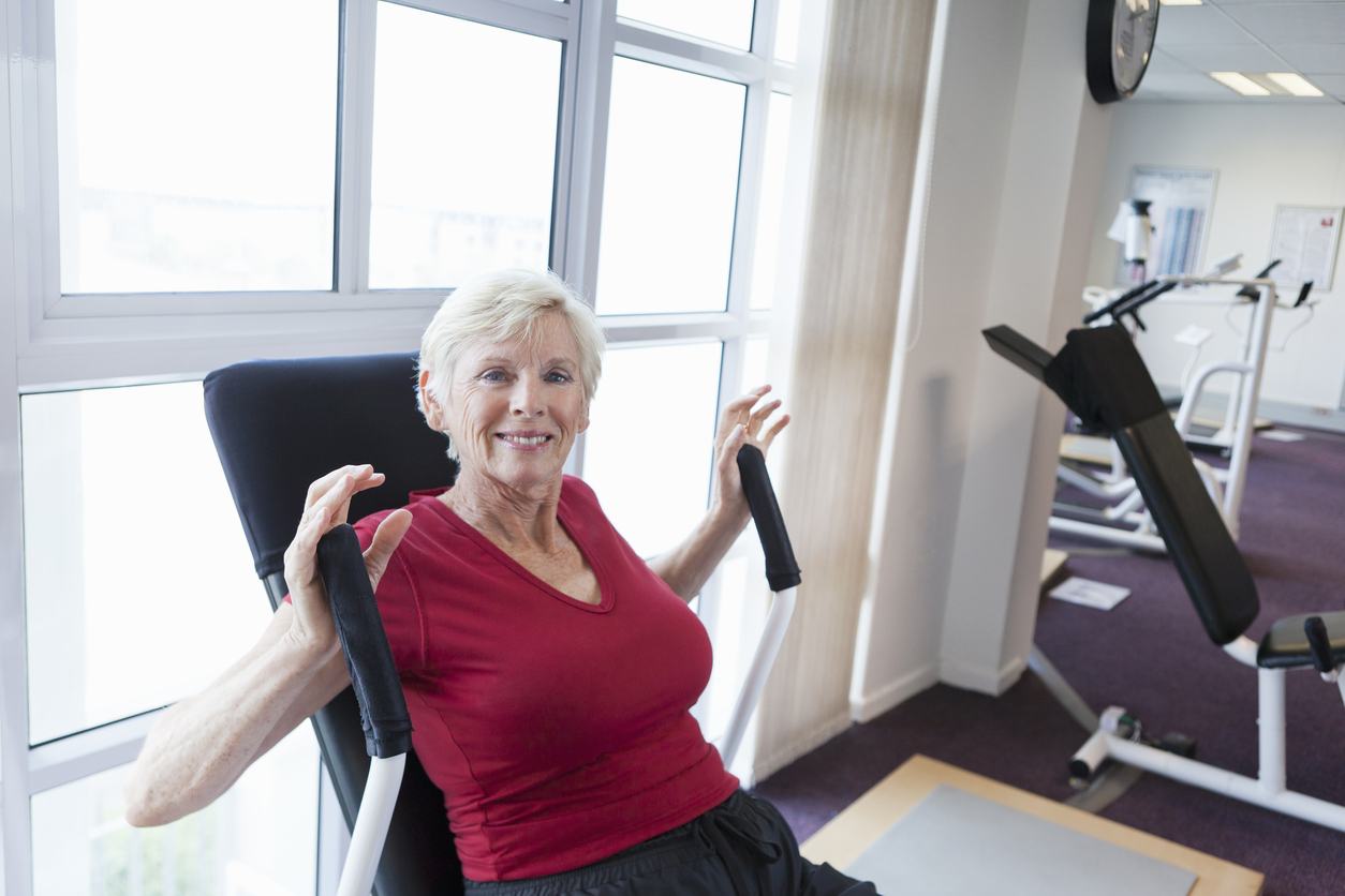 Older woman exercising in gym