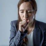 coughing woman. catching a cold. health care concept.