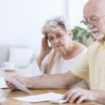 Sad elderly marriage with documents