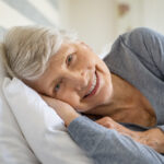 Senior woman resting on bed