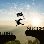 Men jump over silhouette hand hold flag best failure Committed to success.