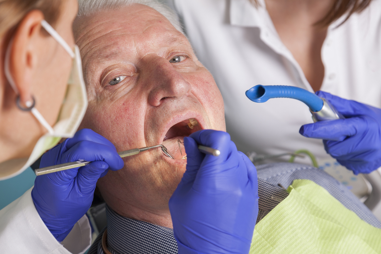 senior man at dental treatment