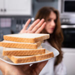 Woman Refusing Bread Slice