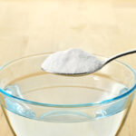 Close-up of baking soda on spoon.