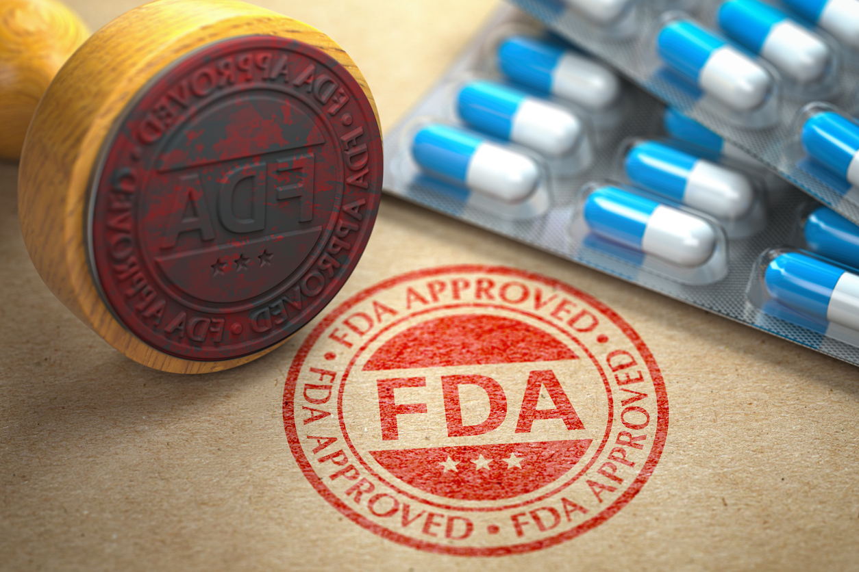 FDA approved concept. Rubber stamp with FDA and pills on craft paper.