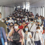 Crowd of unrecognizable business people wearing surgical mask for prevent coronavirus Outbreak