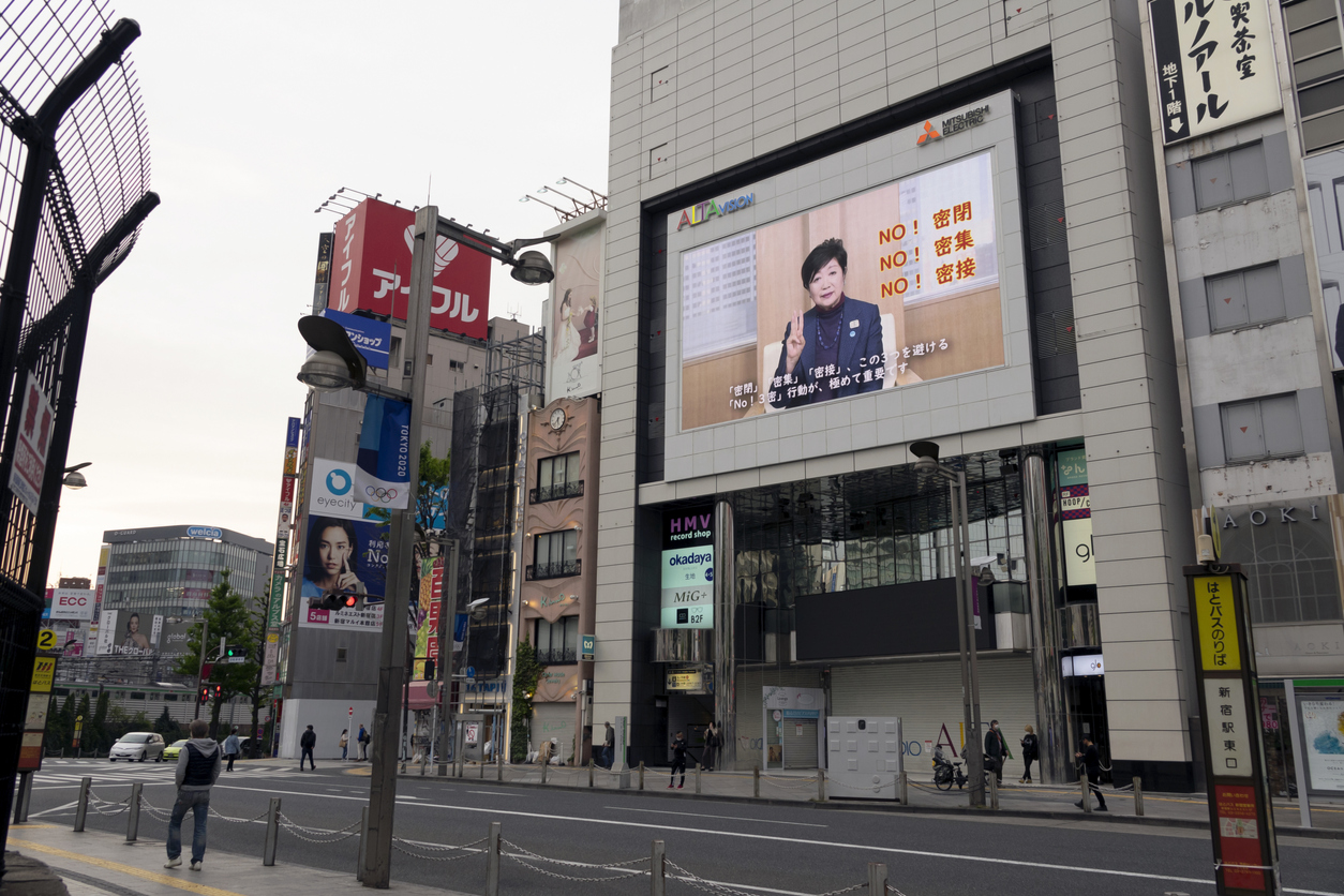 Empty Shinjuku City with a big screen showing Tokyo's Governor Yuriko Koike's announcement about COVID-19 (Coronavirus)