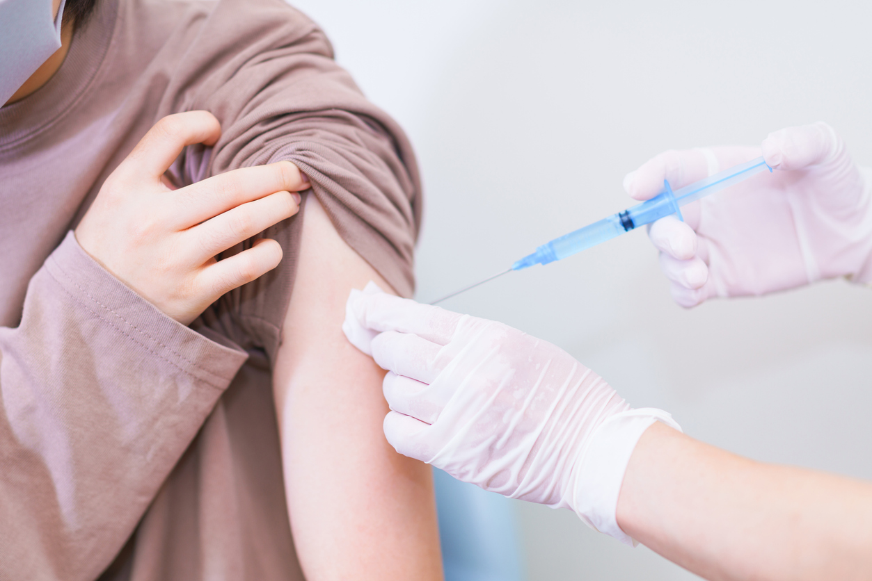 corona virus vaccine injection to young woman
