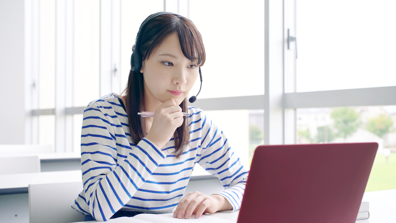 Young asian female student taking online lessons.