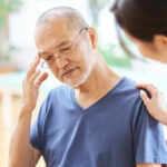 Elderly people with headaches and worried families